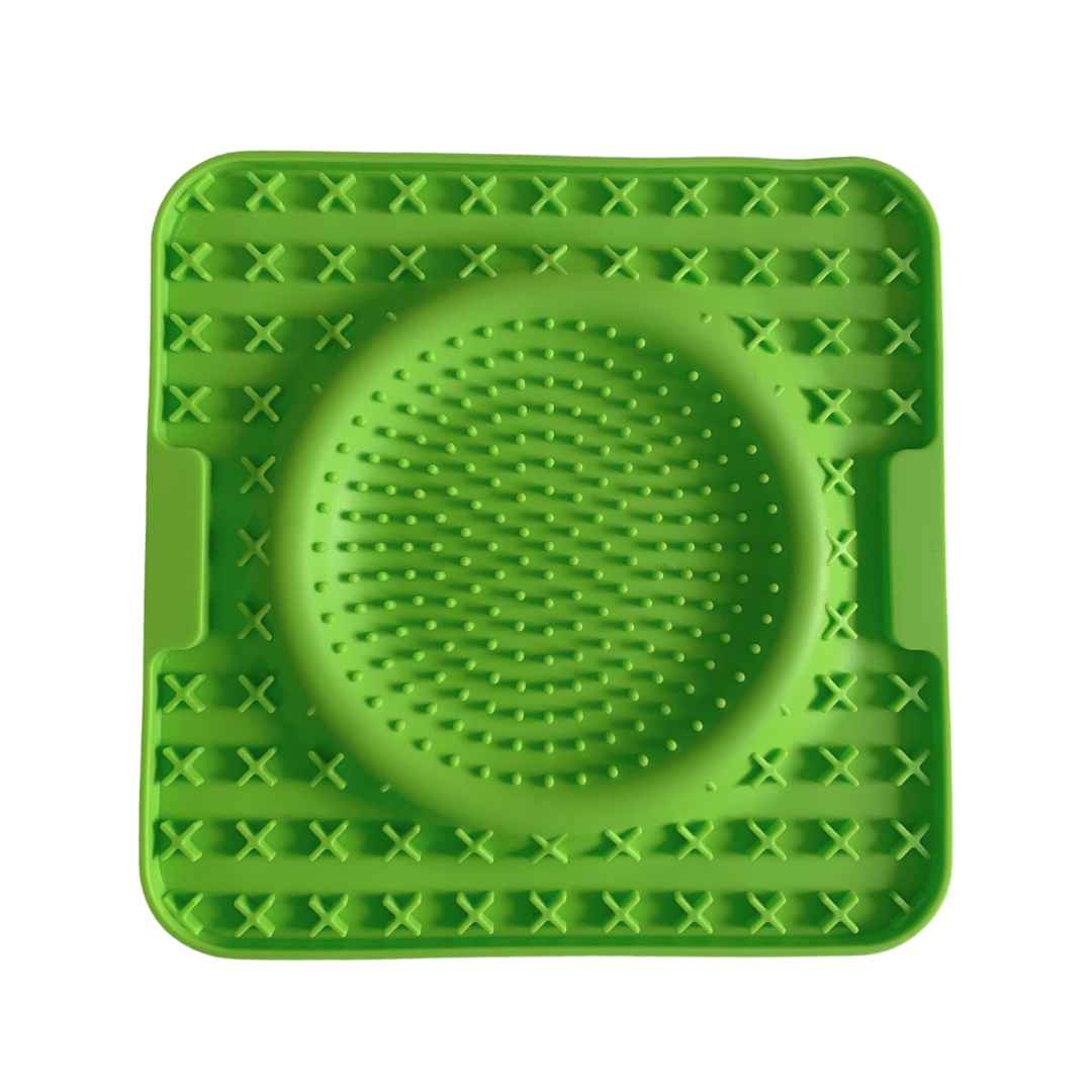 Green silicone dog lick mat with raised textures for enrichment and mental stimulation by Paws In Earnest