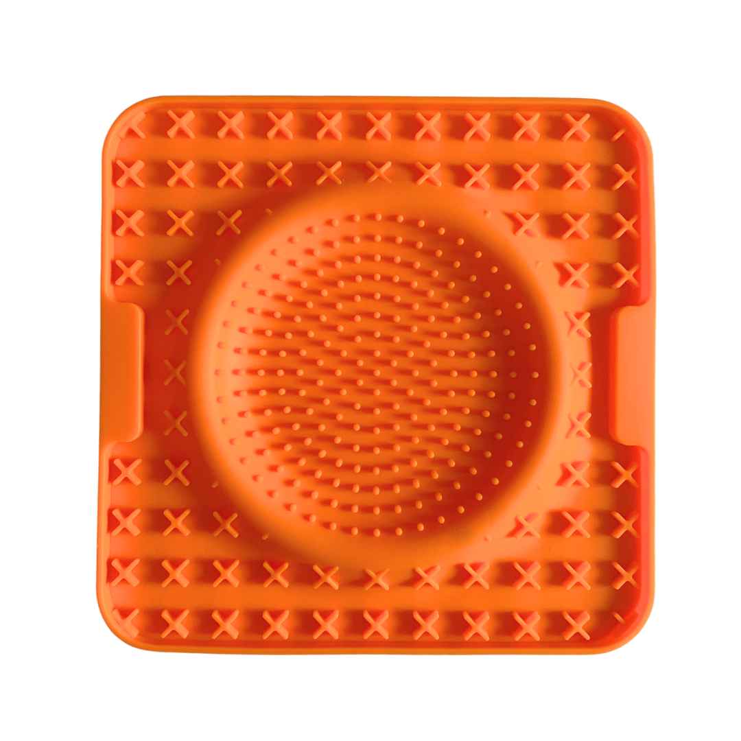 Orange silicone dog lick mat with raised textures for enrichment and mental stimulation by  Paws In Earnest